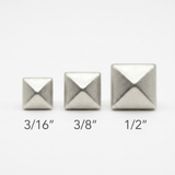 Silver pyramid studs size comparison: 3/16 inch, 3/8 inch, and 1/2 inch